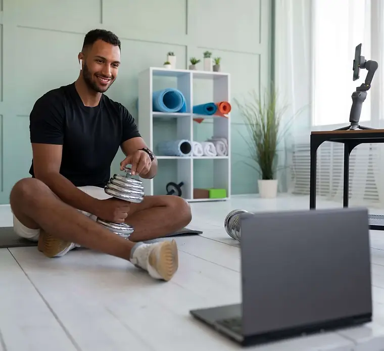 Athlete doing a virtual personal training session at home Athlete doing a virtual personal training session at home