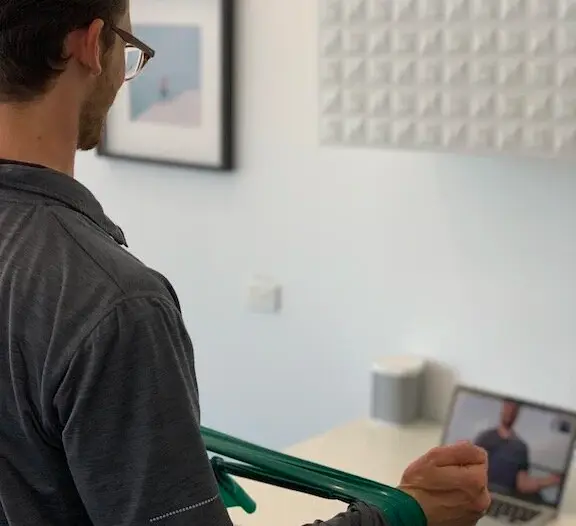 Therapist conducting a virtual physiotherapy consultation via video call Therapist conducting a virtual physiotherapy consultation via video call
